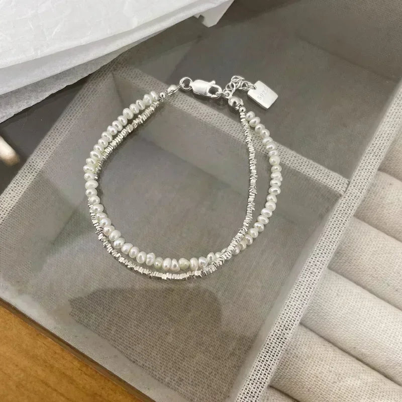 Elegancka bransoletka typu gourmette z perełkami dla kobiet