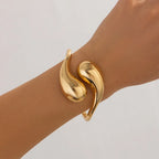 Bransoletka Gourmette z dużymi asymetrycznymi kroplami wody złota