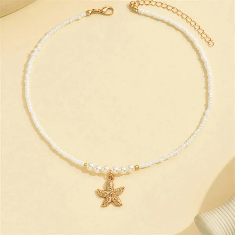 Naszyjnik choker z zawieszką muszli i rozgwiazdy